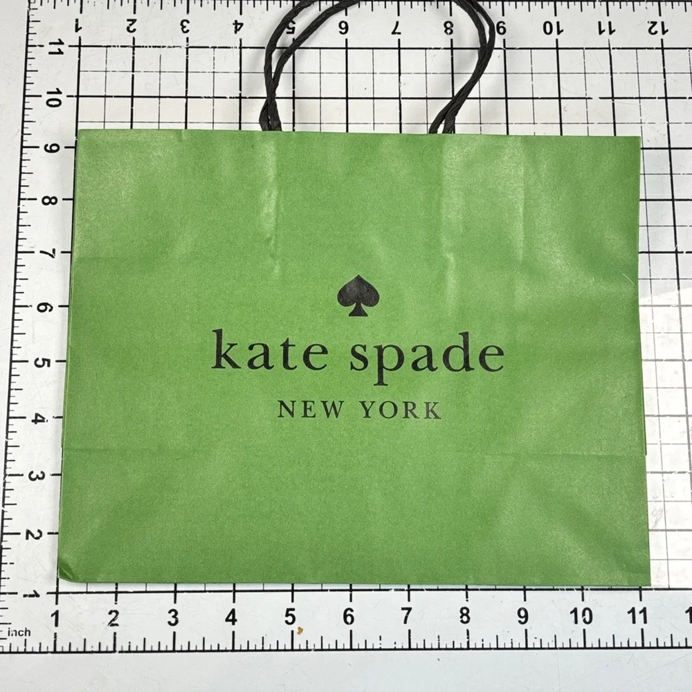 Kate Spade Pink box and green gift bag.